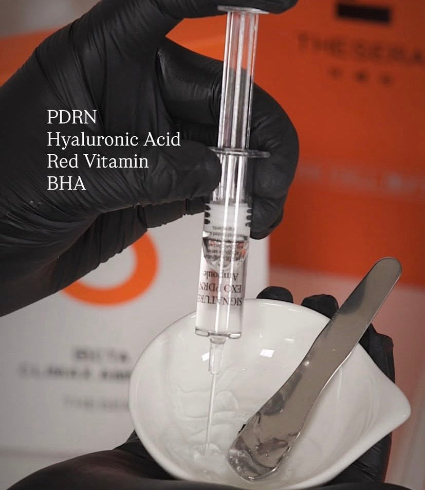 Professional Thesera Korean exosome-based ampoules being prepared for a custom home-care K-Beauty facial protocol to repair and hydrate the skin barrier.