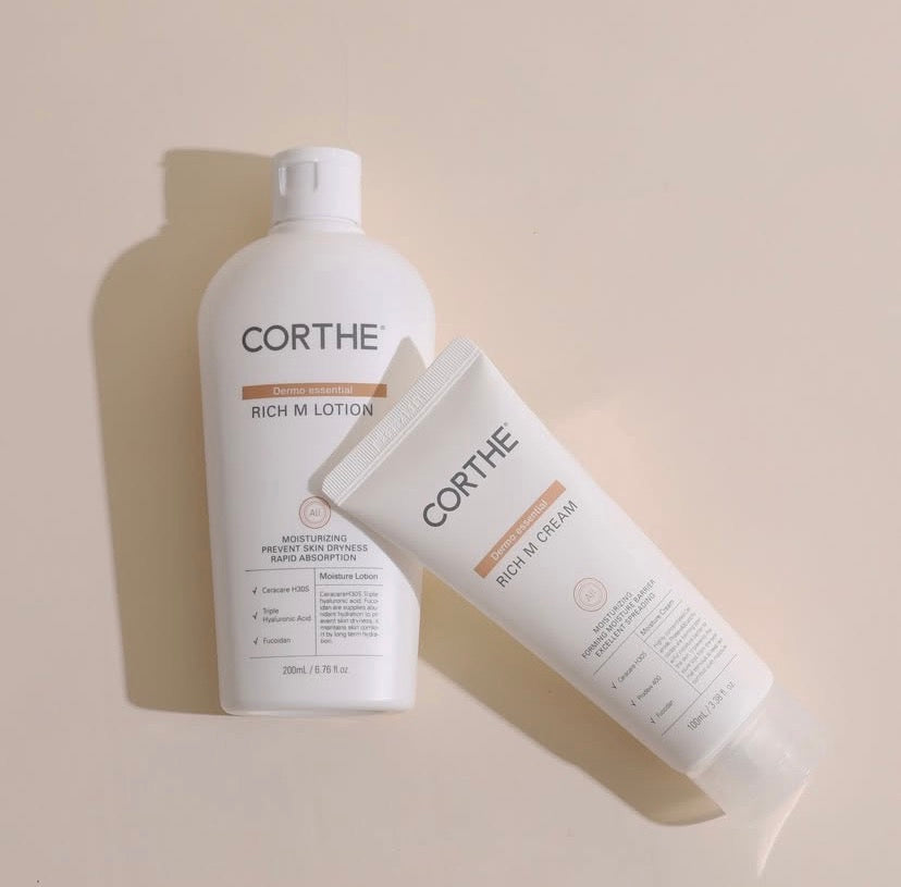 A sleek tube of Corthe Dermo Essential Rich M Cream, a next-generation Korean barrier cream that creates a breathable occlusive seal for lasting skin comfort.