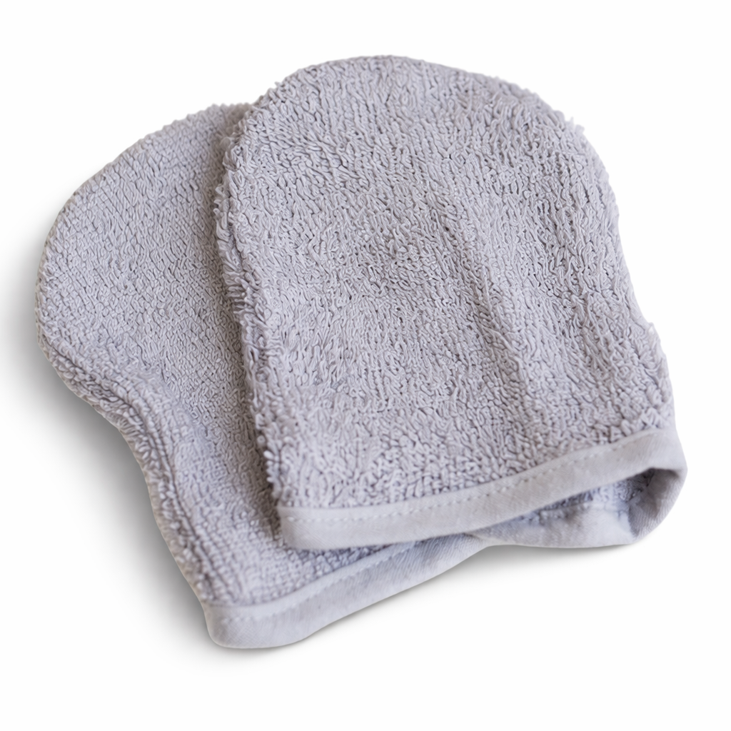 Ultra-soft, light grey bamboo facial cleansing mitts with thick, premium woven texture designed for gentle double cleansing on sensitive skin.