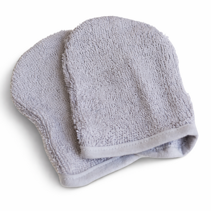 Ultra-soft, light grey bamboo facial cleansing mitts with thick, premium woven texture designed for gentle double cleansing on sensitive skin.