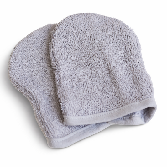 Ultra-soft, light grey bamboo facial cleansing mitts with thick, premium woven texture designed for gentle double cleansing on sensitive skin.