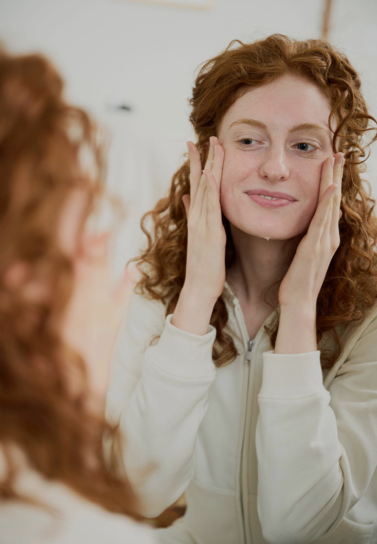 Licensed aesthetician analyzing client skin for virtual Korean skincare consultation