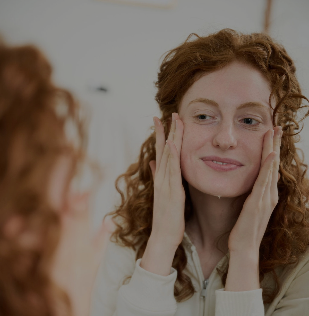 Licensed aesthetician analyzing client skin for virtual Korean skincare consultation